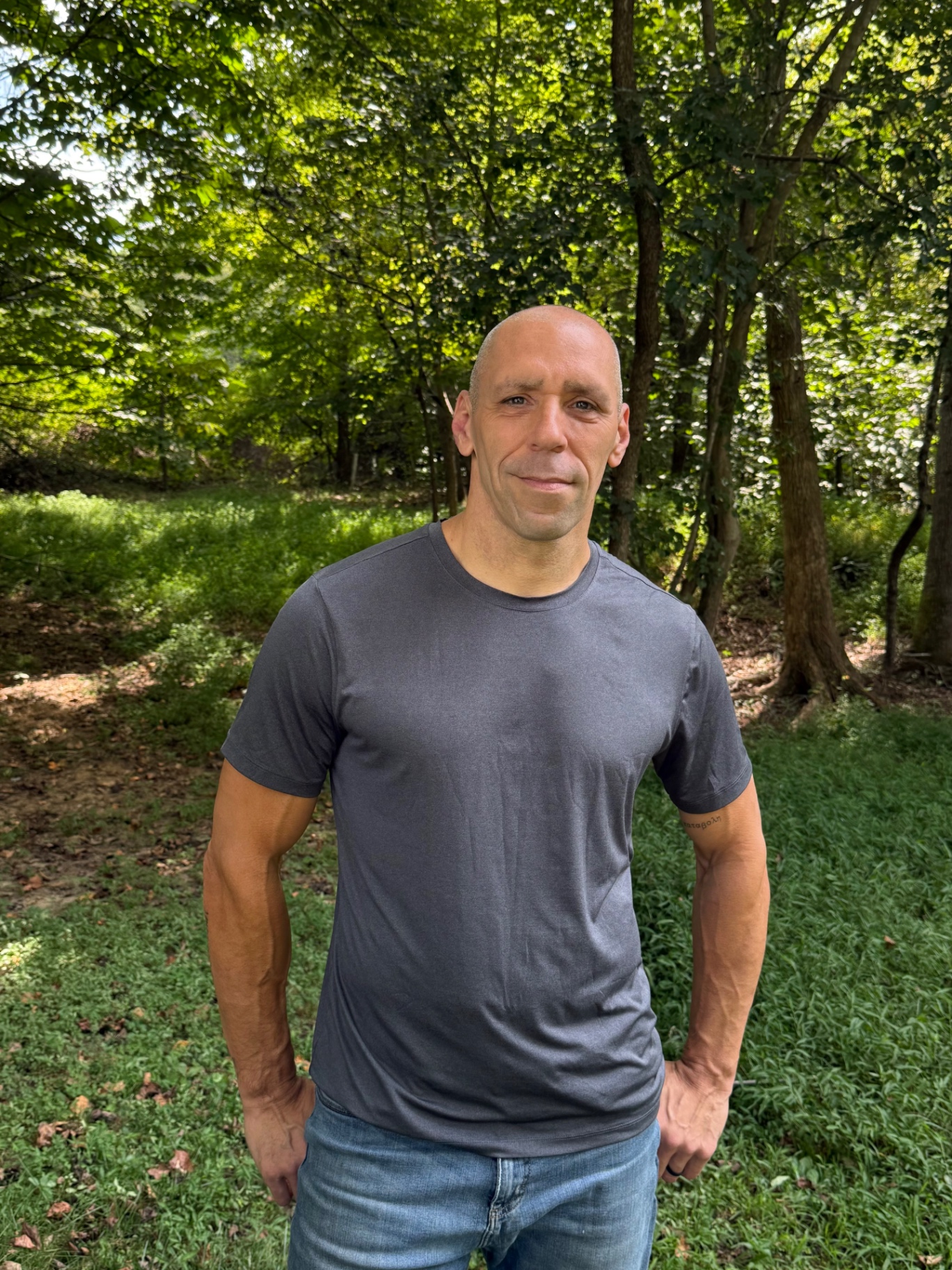 Scott Burgess, founder of Rhizomatic Gardens, in the forest